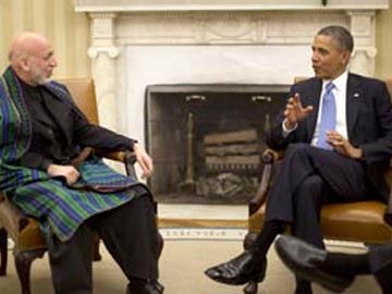 Start peace process with Taliban for troop deal, Hamid Karzai tells Barack Obama 