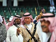 Britain's Prince Charles matches steps with Saudi royals in sword dance