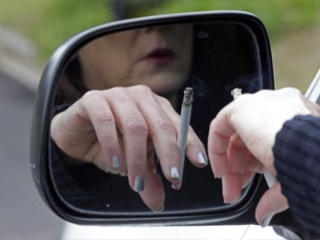 Britain to ban smoking in cars carrying children