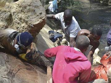 With picks and prayers, illegal miners risk all for South African gold 