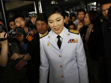 Thai PM leaves Bangkok as bombs, gunfire punctuate unrest