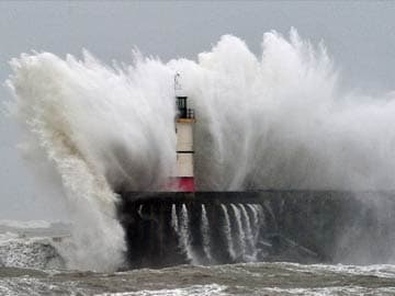Storms in UK cause power cuts, batter sea walls