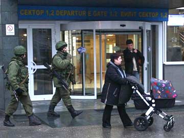 Armed men seize two airports in Ukraine's Crimea, Russia denies involvement