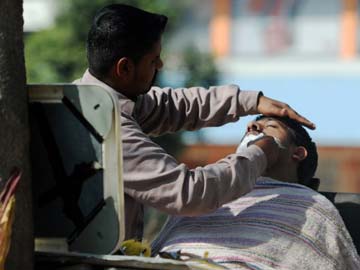 Two Indians arrested in Singapore for moonlighting as barbers