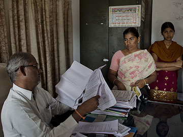 After India farm suicides, families inherit debt