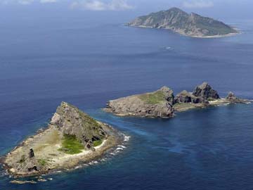 China says Japan's 'hype' on air defence zone spreads tension 