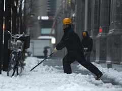 Heavy snow kills 12 in Japan, disrupts power and flights