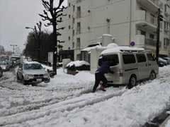 More travel chaos in Japan as snow storm kills three