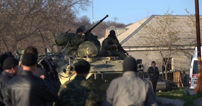 Armoured vehicles break into Ukraine base in Crimea, shots fired