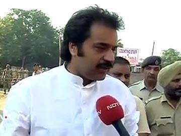 Kuldeep Bishnoi drives a tractor on way to file nomination in Hisar