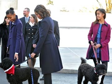 Barack Obama 'stuck with two dogs' as Michelle away in China
