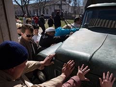 Protesters storm Ukraine military base in west Crimea