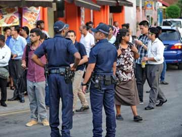 Three Indians among 17 charged for rioting in Singapore