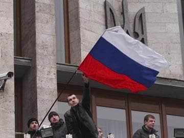 Activists replant Russian flag above administrative headquarters in Ukraine city