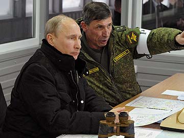 Vladimir Putin calms war fears but defiant on keeping Crimea