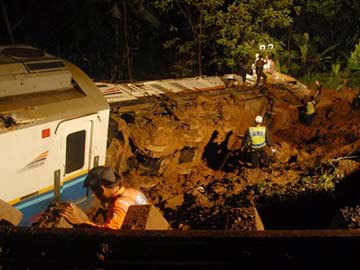 Indonesia train derails in landslide; three dead