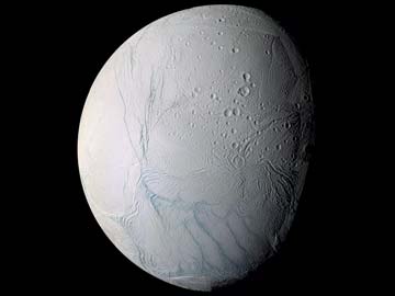 Under icy surface of a Saturn moon lies a sea of water, scientists say 