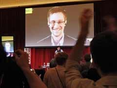 Edward Snowden, Glenn Greenwald urge caution of wider government monitoring at Amnesty event