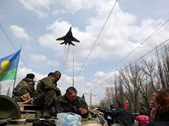 Ukraine military plane hit by gunfire above rebel-held town
