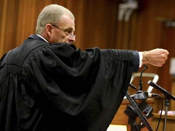Prosecutor hammers away as Oscar Pistorius resumes testimony