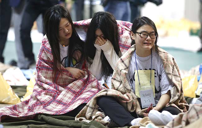 With many still missing, divers search sunken South Korean ferry