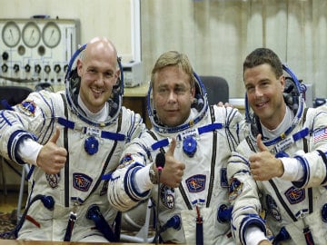 Russian Spaceship With Three-Man Crew Docks at Space Station