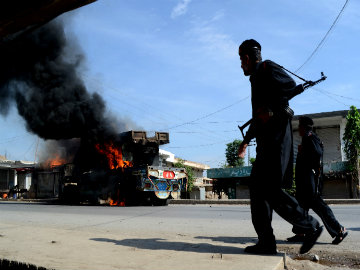 Attacks Kill Ten Pakistani Troops; Missile Tested
