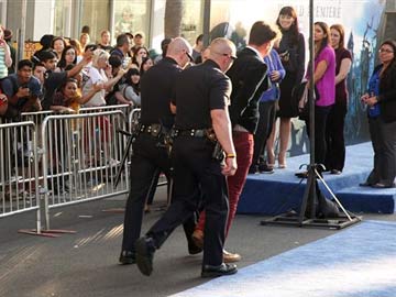 Brad Pitt Hit in the Face by Infamous Red Carpet Prankster