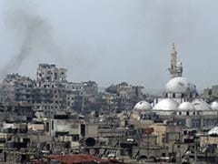 Syrians Stream Back into Devastated Homs Old City