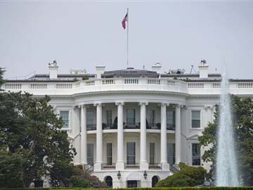 Sun Rises on Solar Panels on White House Roof