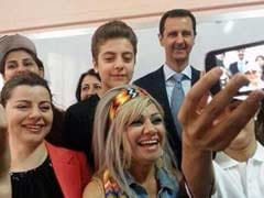 Syria's Bashar al-Assad Poses for a 'Selfie' as He, First Lady Vote