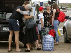 Thousands Flee Ukraine for Russia; Truce Nears End