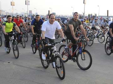 Dressed for Cycling, Egypt's President Fattah al-Sisi Calls for Help on Fuel Subsidies