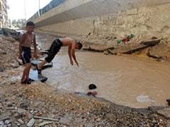 In Syria's Aleppo, Children Swim in Bomb Craters