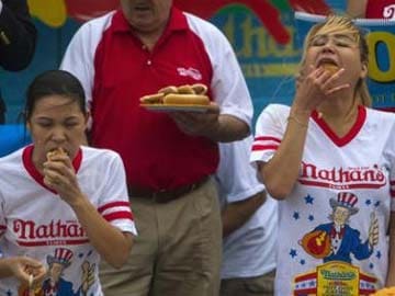 Hot Dogs Gobbled, Small-Town Parades Cheered as US Marks Soggy July 4