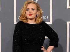 British Singer Adele Wins Damages Over Photos of Son