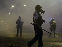 Police Deploy Tear Gas to Impose Curfew in Ferguson