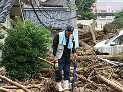 Rescuers Comb Through Devastation of Japan Landslide