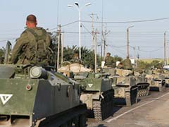 Russia Masses Military Vehicles as Aid Convoy Waits Near Ukraine Border