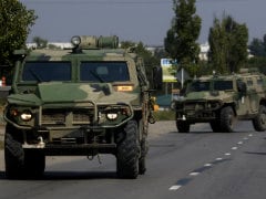 Ukraine Says Russian Tanks Flatten Town; EU to Threaten More Sanctions