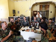 Syrian Soldiers Celebrate Fall of Rebel Stronghold