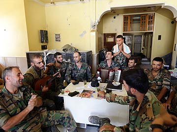 Syrian Soldiers Celebrate Fall of Rebel Stronghold