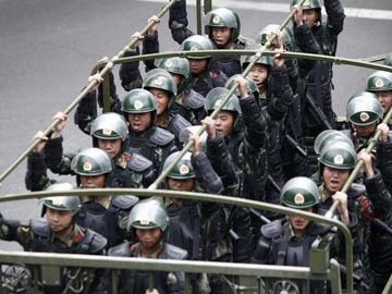 China Says 9 Suspects Killed in Xinjiang Raid 