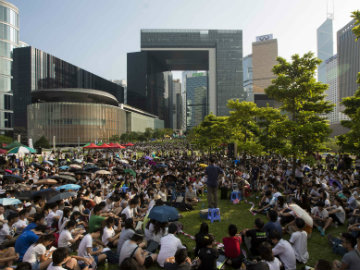 Protests Disrupt Hong Kong Travel and Businesses