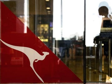qantas airways asked baggage missing pay rs over passenger terminal emblem walks sydney airport past international