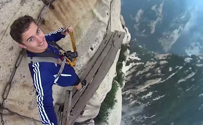 Really Brave or Just Very Stupid? This Man Walked a Plank on a Mountain
