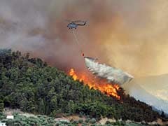 Air Force's 'Bambi Bucket' Helps Control Raging Forest Fire