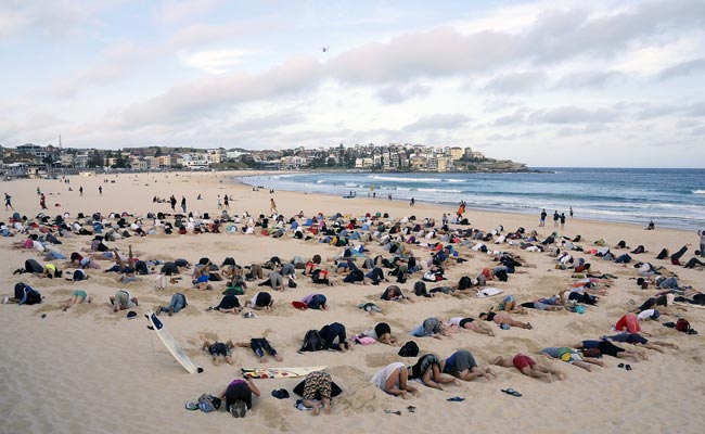 G20 Climate Protesters Bury Heads in Bondi Sands in Australia