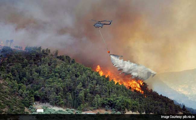 Air Force's 'Bambi Bucket' Helps Control Raging Forest Fire