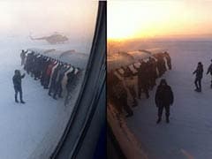 Passengers Get Out and Push Frozen Siberian Plane